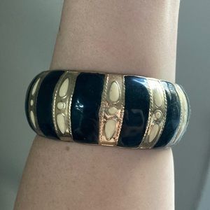 Wide metal bangle with black & ivory enamel detail
